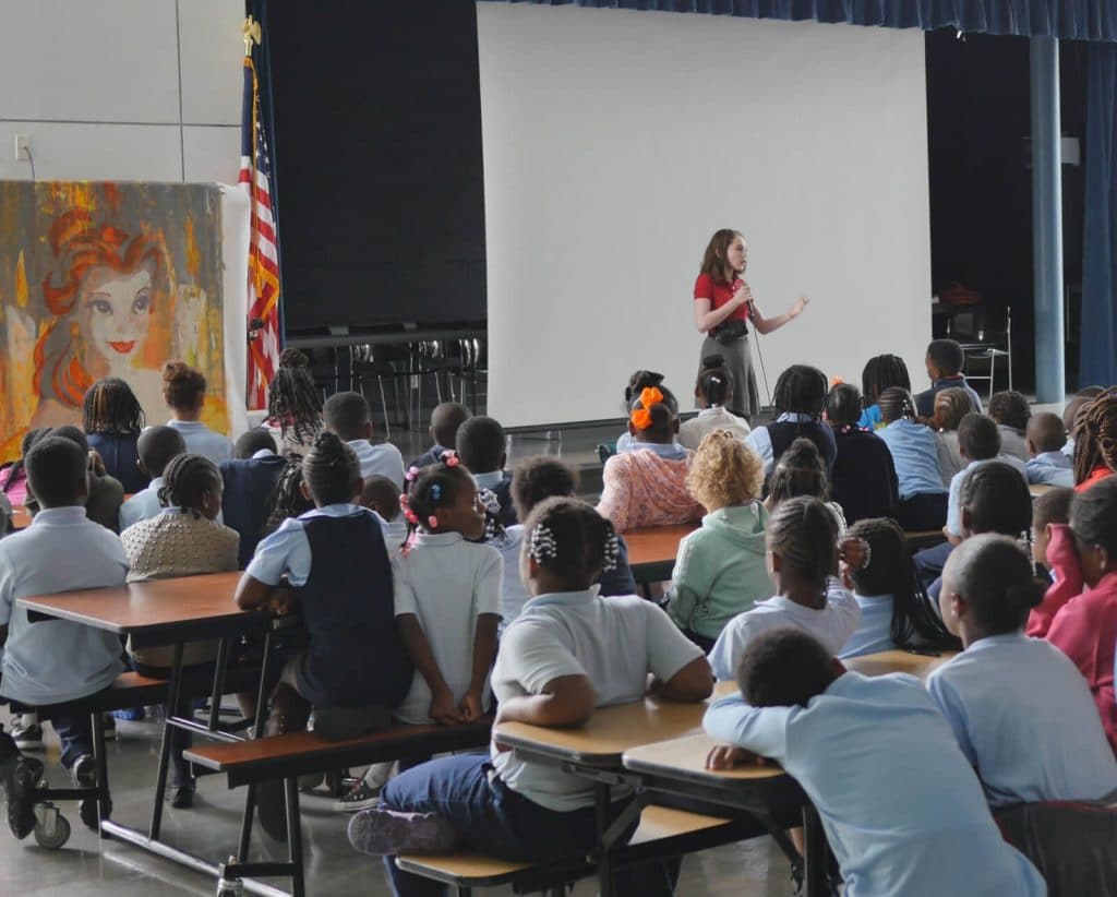 Autumn holds an assembly at Savoy Elementary school in Washington D.C. (Photo courtesy of Doug de Forest)