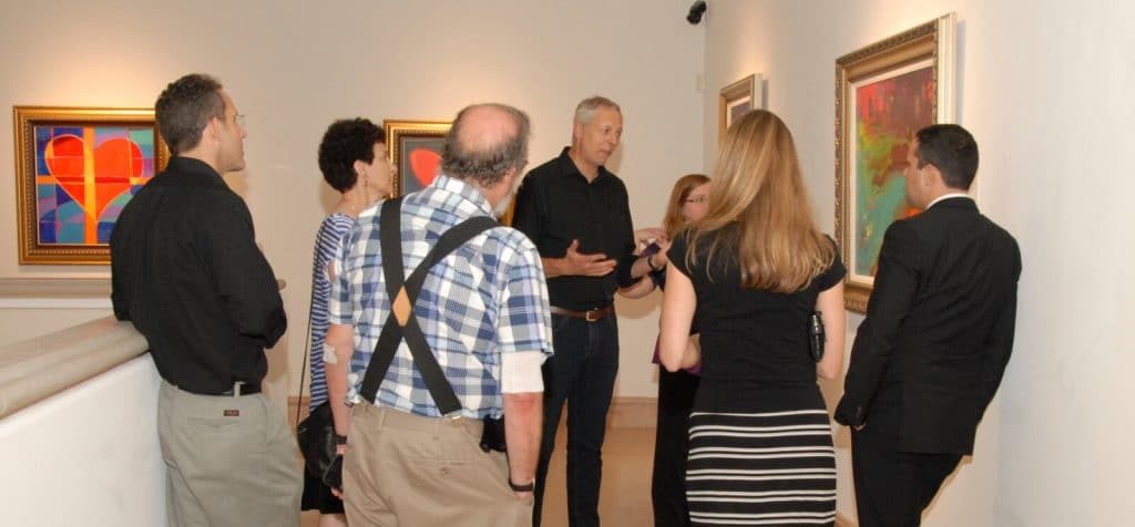 Simon Bull discussing his artwork during his exhibition "Language of Color."