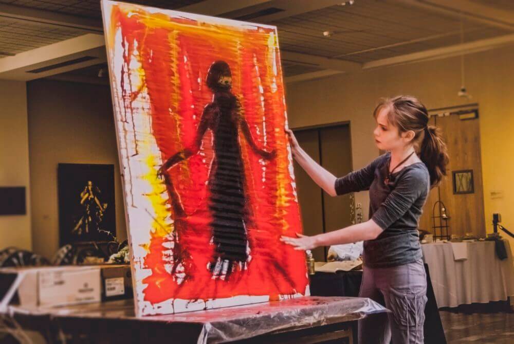 Autumn de Forest demonstrating a painting technique at the Butler Institute of American Art (Photo courtesy of Carole Sorrell)