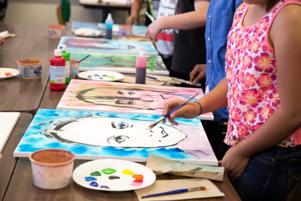 Students work on self portraits at San Bernardino's Barton Elementary in California during a Turnaround Arts event. (Photo courtesy of T Studio)