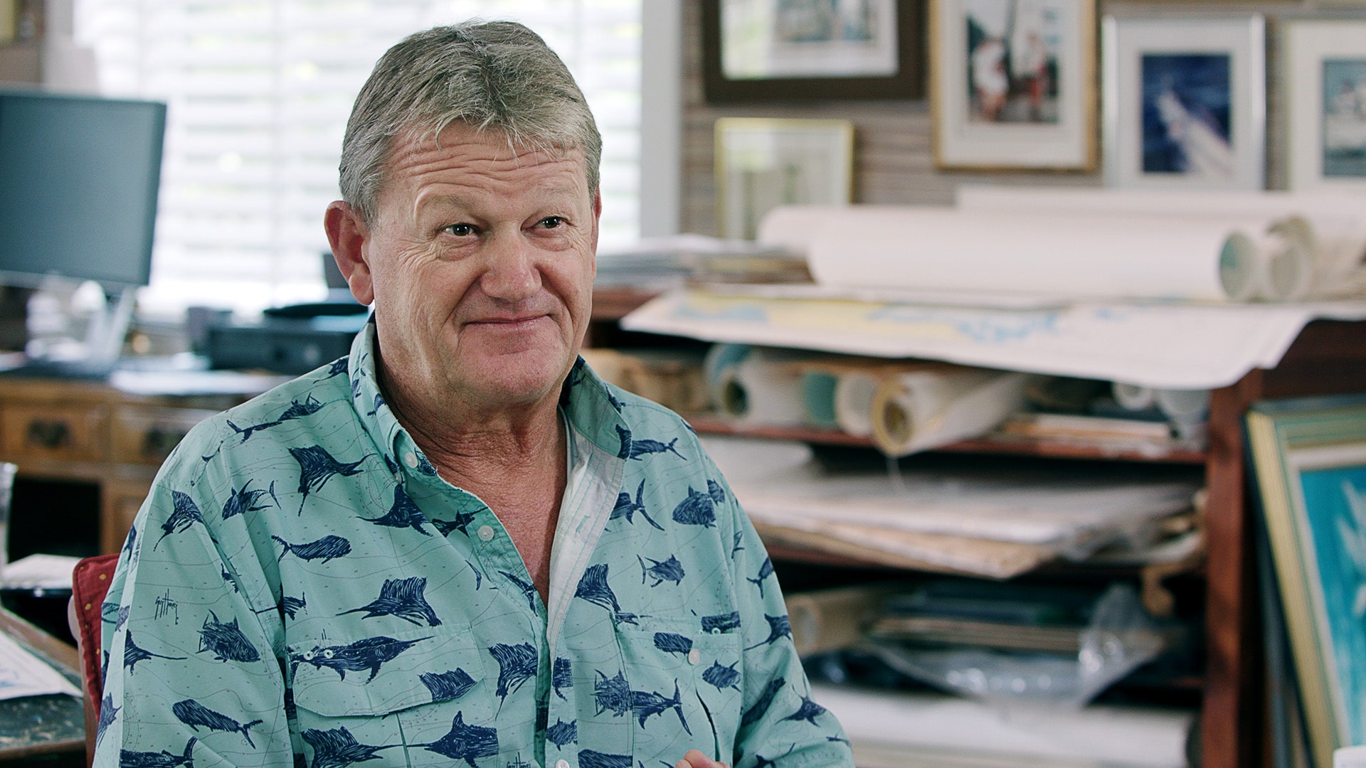 Guy Harvey, wearing one of his trademark "Guy Harvey shirts," at his studio in Grand Cayman, Guy Harvey art, Park West Gallery