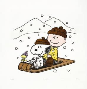 Charlie Brown and Snoopy riding a sled together through a snowy landscape