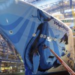 The finishing touches being out on Wyland's hull mural for Norwegian Bliss (Image courtesy of Meyer Werft)
