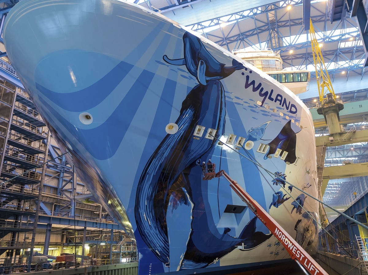 The finishing touches being put on Wyland's hull mural for Norwegian Bliss (Image courtesy of Meyer Werft)