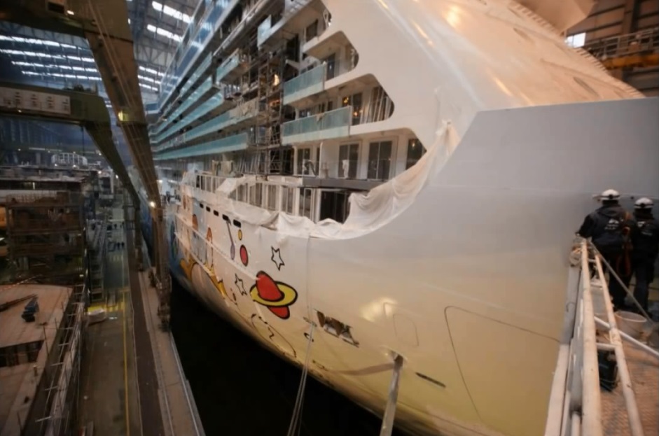 In progress shot of the Max hull art being applied in the Meyer Werft shipyard.