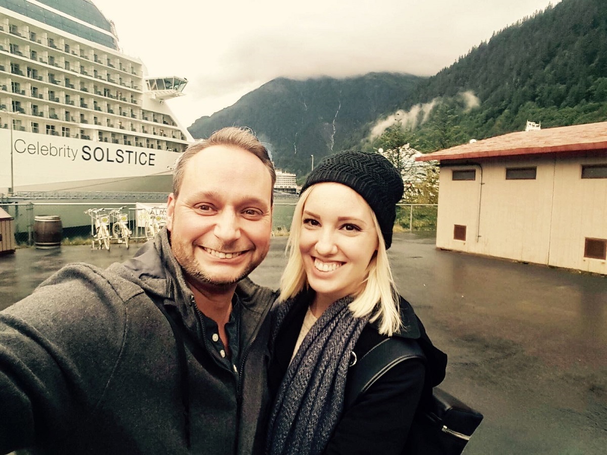 Auctioneer Spotlight: Ty and Gracie Braga in front of the Celebrity Solstice.