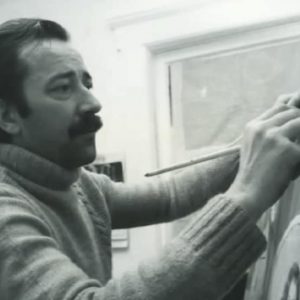 Pino working on one of his paintings.