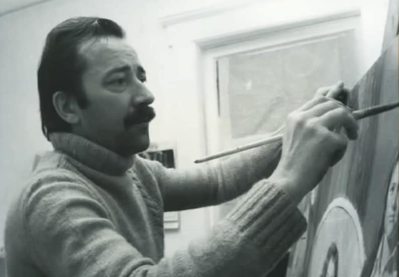 Pino working on one of his paintings.