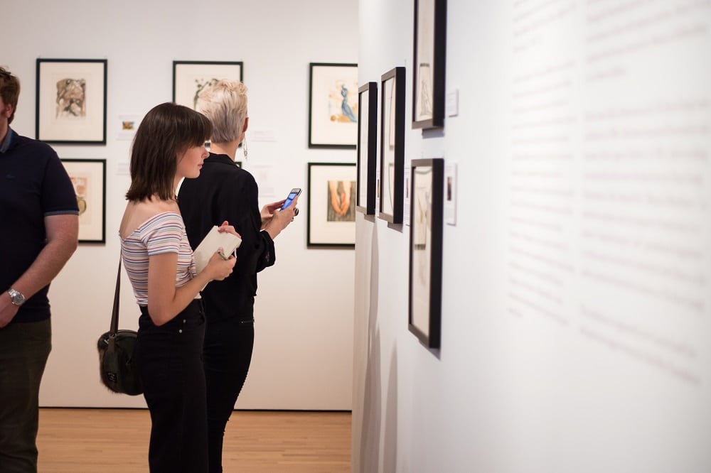 A patron browses "Salvador Dalí's Stairway to Heaven" at Louisiana’s Hilliard University Art Museum.