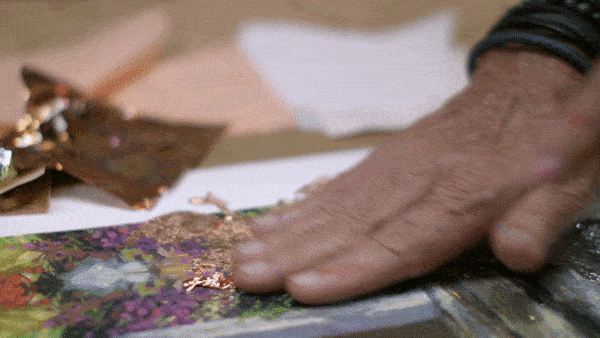 James Coleman adding metallic leafing to one of his paintings.