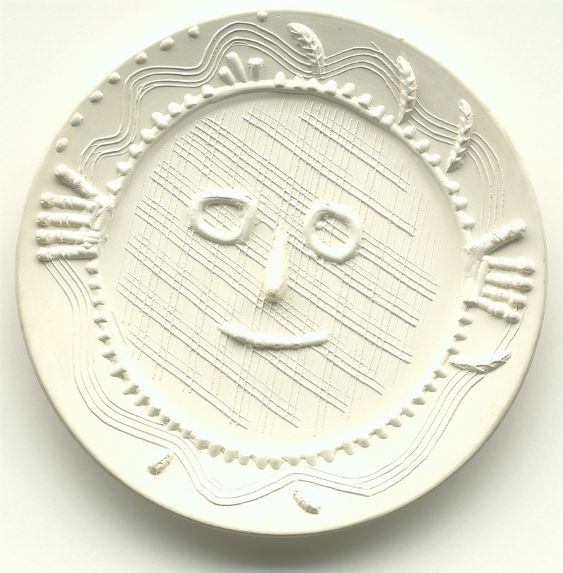 "Visage aux Mains" (Face with Hands; 1956), Pablo Picasso. White earthenware clay round dish. From the Picasso Ceramics collection at Park West Gallery