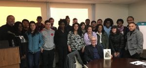 Park West Gallery Director Morris Shapiro poses with SUNY's Kathryn W. Davis Global Community Scholars