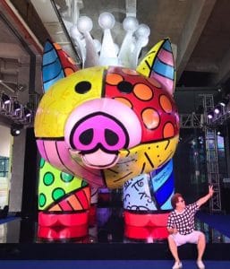 Romero Britto posing in front of his sculpture in Fuzhou, China.