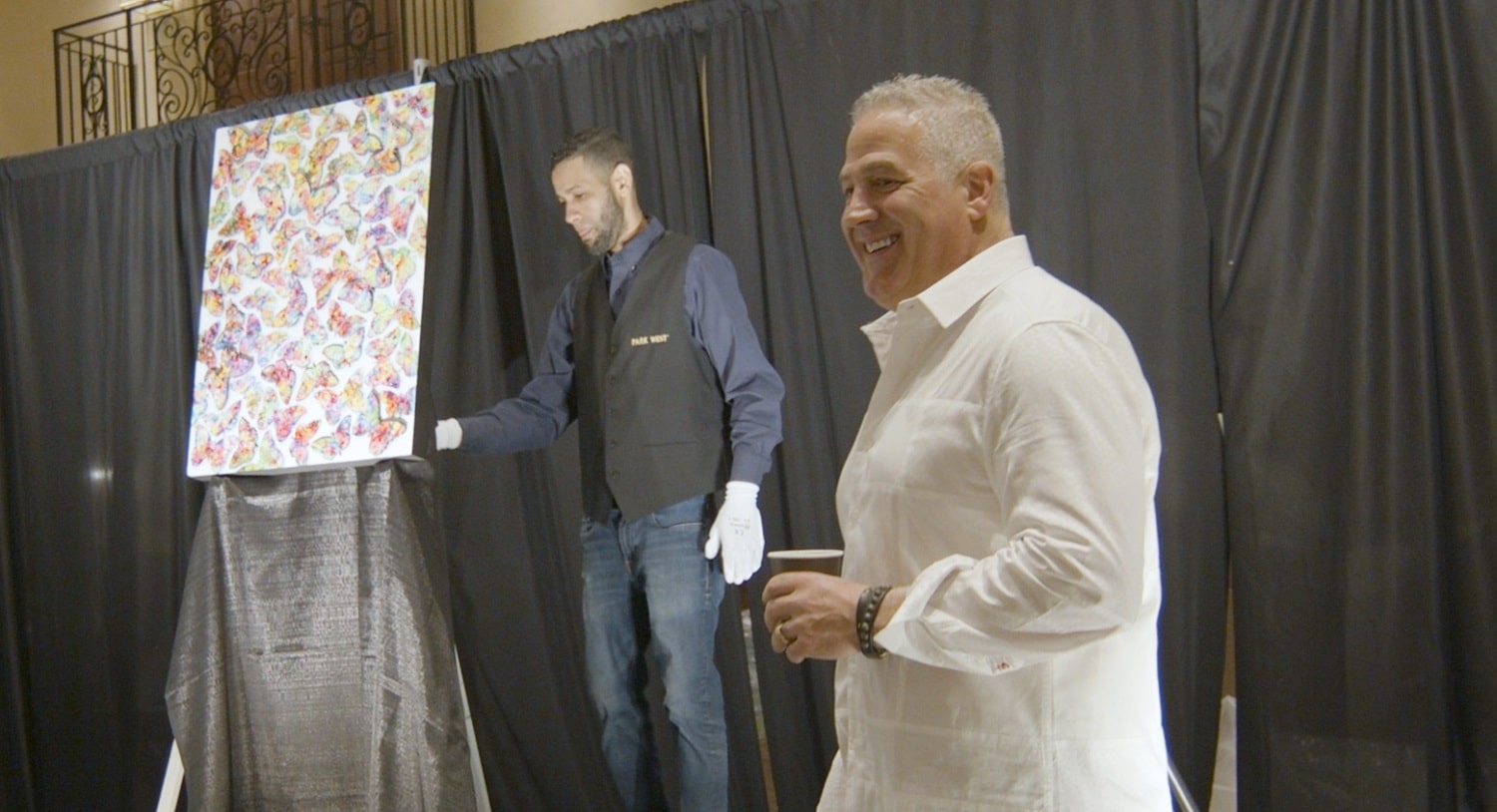 Artist Tim Yanke poses in front of his augmented reality-enhanced sculptograph.