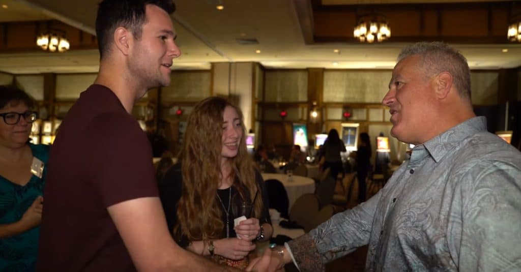 Two fans meet Tim Yanke at a Park West Gallery event