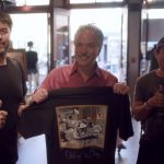 Scott Jacobs poses with fans at his gallery in Deadwood, South Dakota.