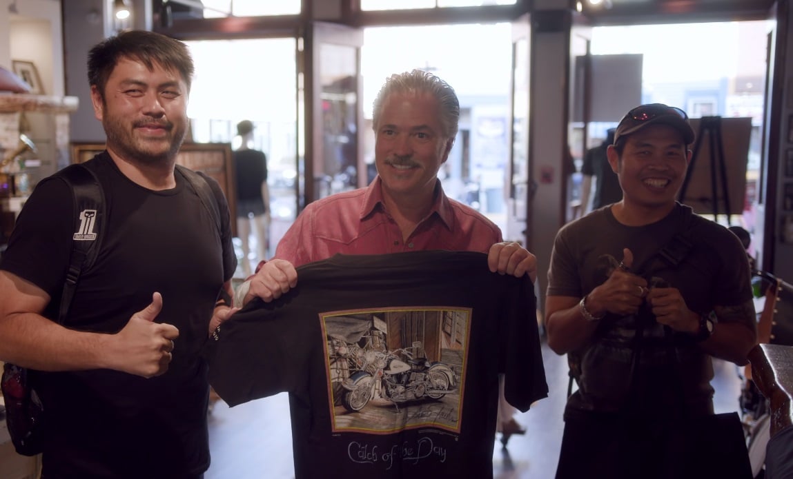 Scott Jacobs poses with fans at his gallery in Deadwood, South Dakota.