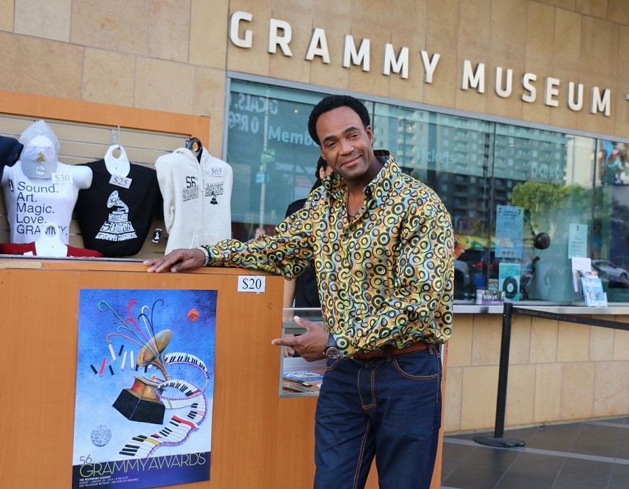 Glenn poses with his artwork in front of the Grammy Museum