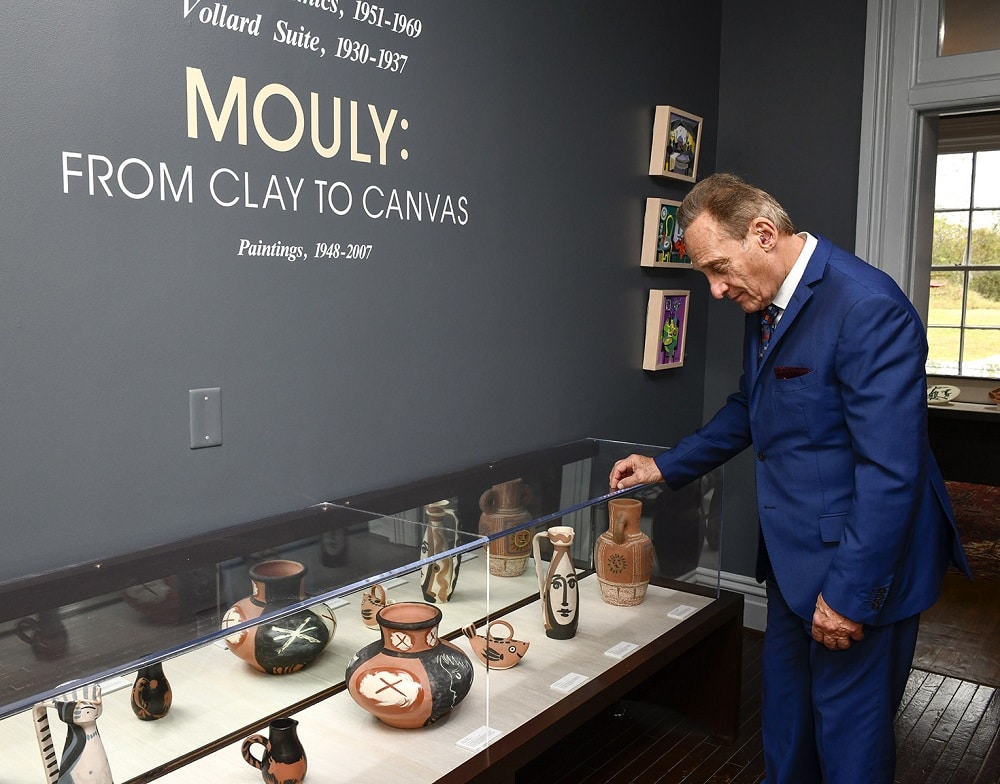 Park West founder Albert Scaglione admires Picasso's ceramics at the Monthaven Arts Center.