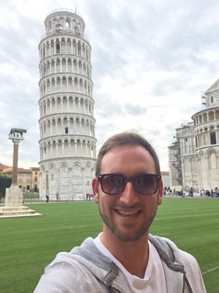 Henry-John enjoying the Leaning Tower of Pisa during his travels as an auctioneer.