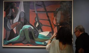 Monthaven patrons admire a work by Marcel Mouly.
