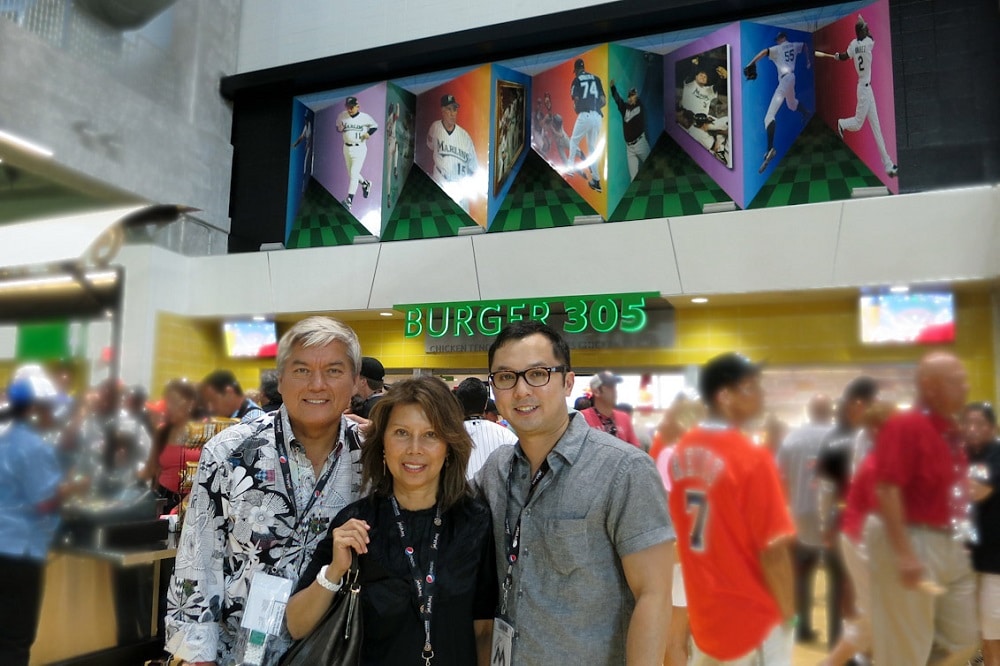 The Pangborn family posing in front of Dominic's "Art in Motion" at Marlins Park.