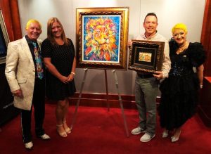 Duaiv and Magella posing with collectors on the Norwegian Pearl