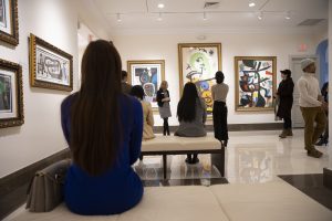 A museum tour group learns about the unique style of Spanish artist Joan Miró.