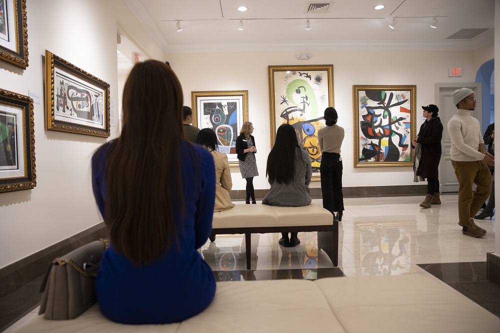 A museum tour group learns about the unique style of Spanish artist Joan Miró. 