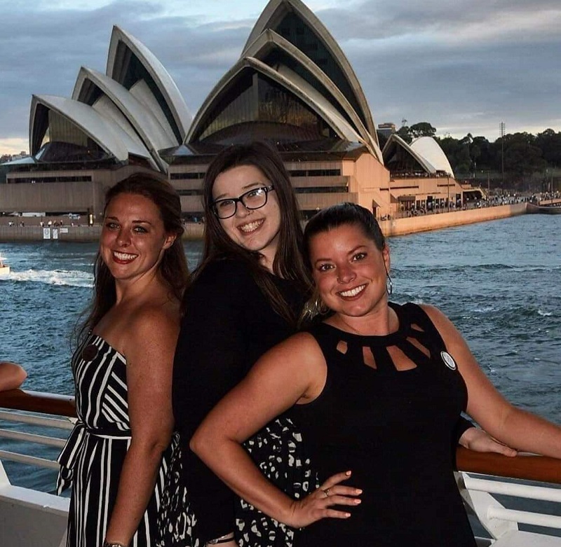 Gandy and some of her Park West co-workers pose in front of the Sydney Opera House.