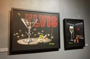 Godard's "Elvi-Tini" painting is a perfect fit for the Vegas-theme of "The Secret Life of Olives."
