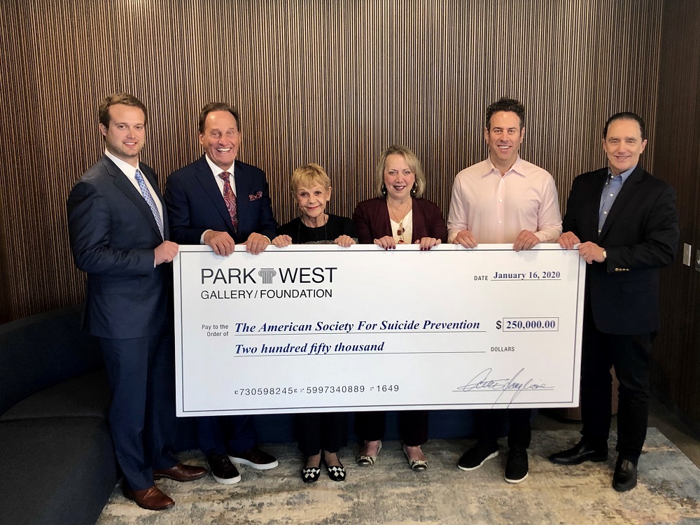 Representatives from Park West Gallery and the Park West Foundation present their donation check to Robert Gebbia, CEO of the American Foundation for Suicide Prevention. (Pictured left to right: Michael Karay, Park West's Associate Vice President of Merchandising; Albert Scaglione, Park West's Founder and CEO; Mitsie Scaglione, Park West's Corporate Secretary; Diane Pandolfi, Director of the Park West Foundation; Marc Scaglione, President of Park West Gallery; and Robert Gebbia.)