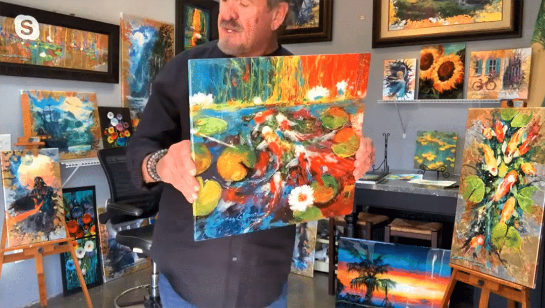 James Coleman holds a painting up to the camera