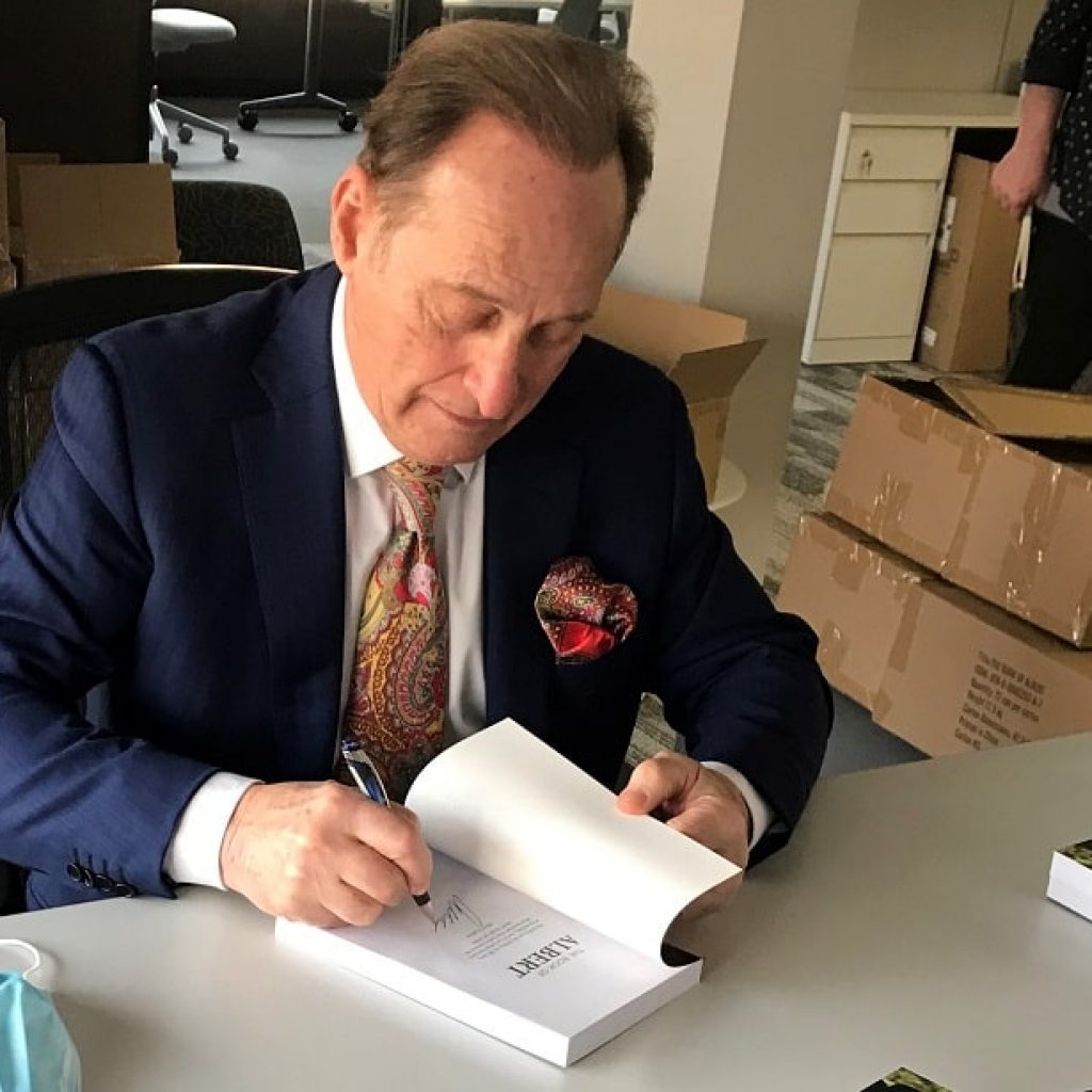 Albert Scaglione signing copies of "The Book of Albert" at the Park West Foundation in Michigan.