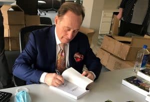 Albert Scaglione signing copies of "The Book of Albert" at the Park West Foundation in Michigan.