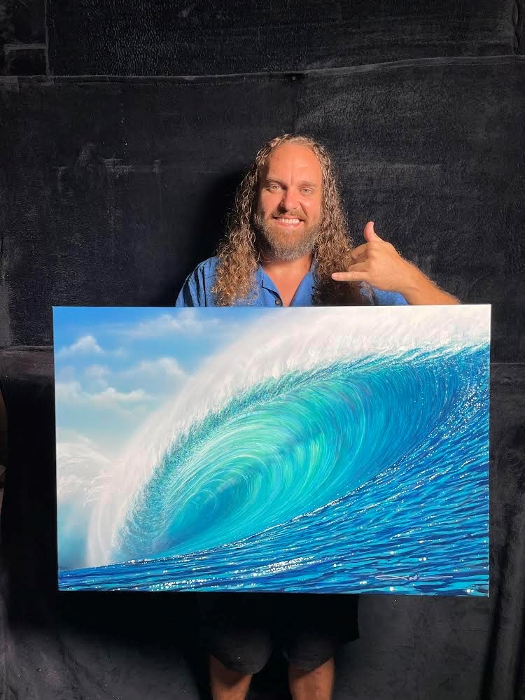 Artist Chris Sebo poses with one of his creations.