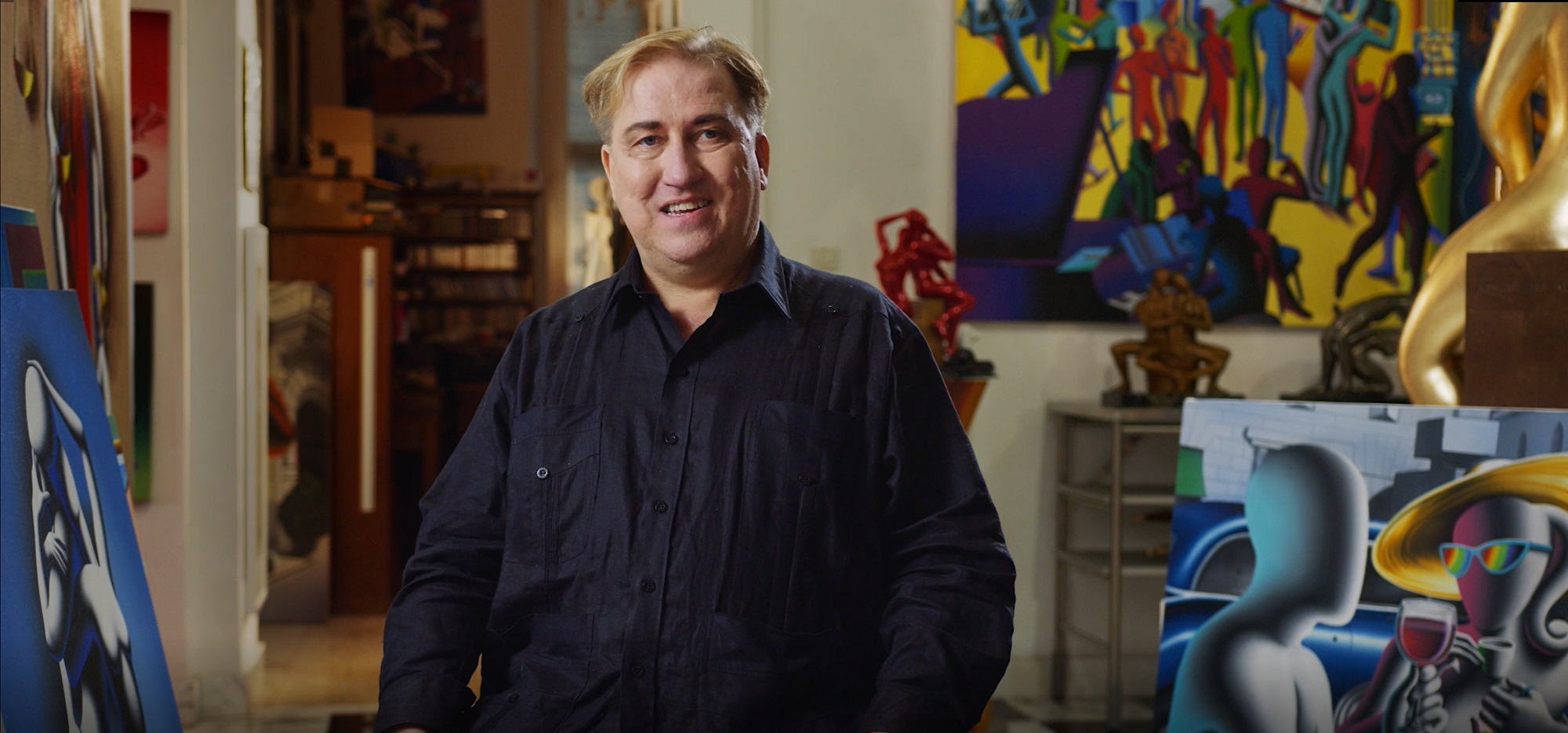 Mark Kostabi sitting in his Rome studio