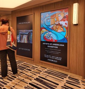 The Park West Prima gallery has huge video screens that play videos featuring our artists and provide updates on all the arts programming throughout the cruise.