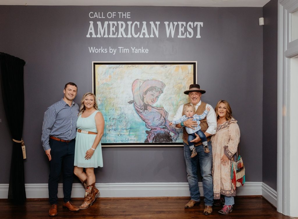 (Left to right): Tim's son Roman, daughter-in-law Lucie, Tim holding his grandson Rhyland, and Tim's wife Nicky Yanke