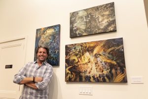 Made in Vegas winner Chris Elliman poses with his artwork at Park West Vegas