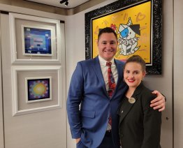 Inside the Park West Gallery on Norwegian Prima with Auctioneer Jared Hamer
